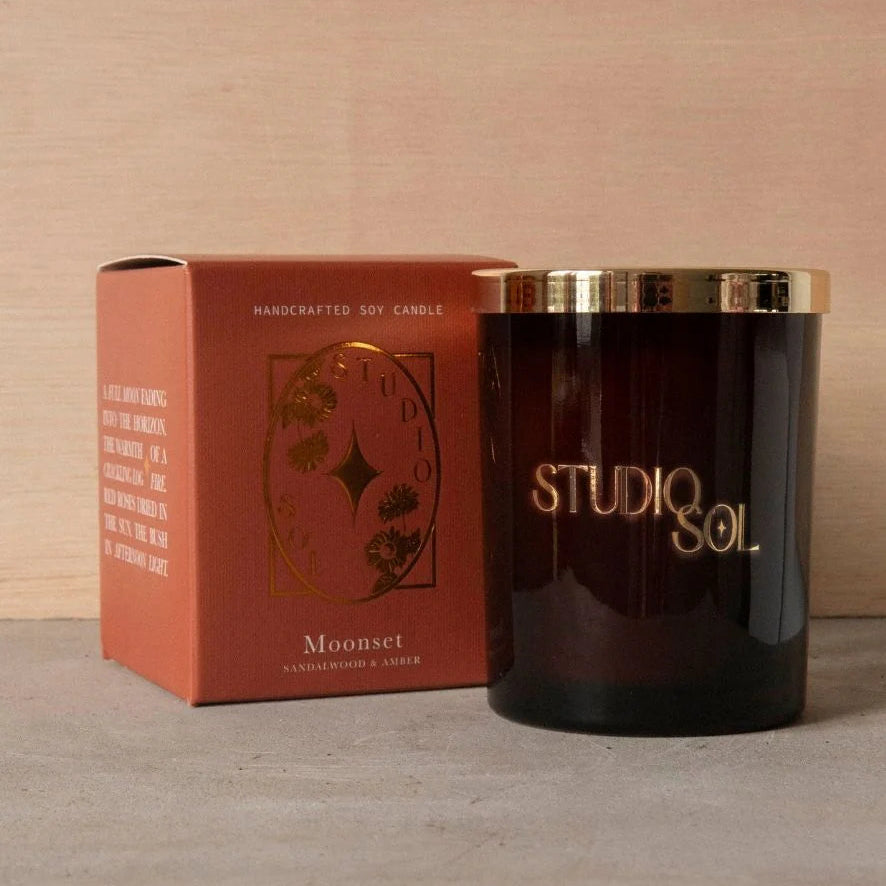 Studio Sol candle with packaging on a neutral background