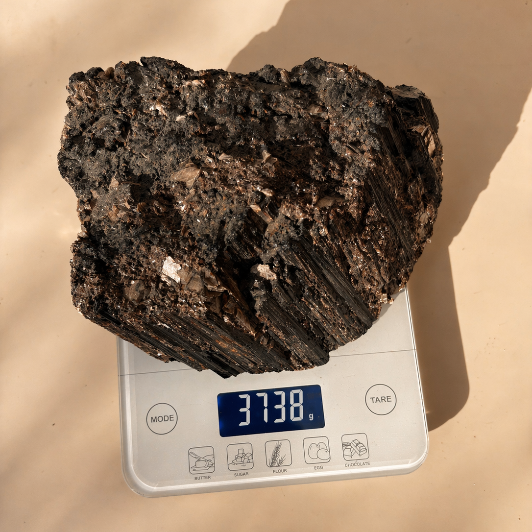 Black Tourmaline on a digital scale with a beige background