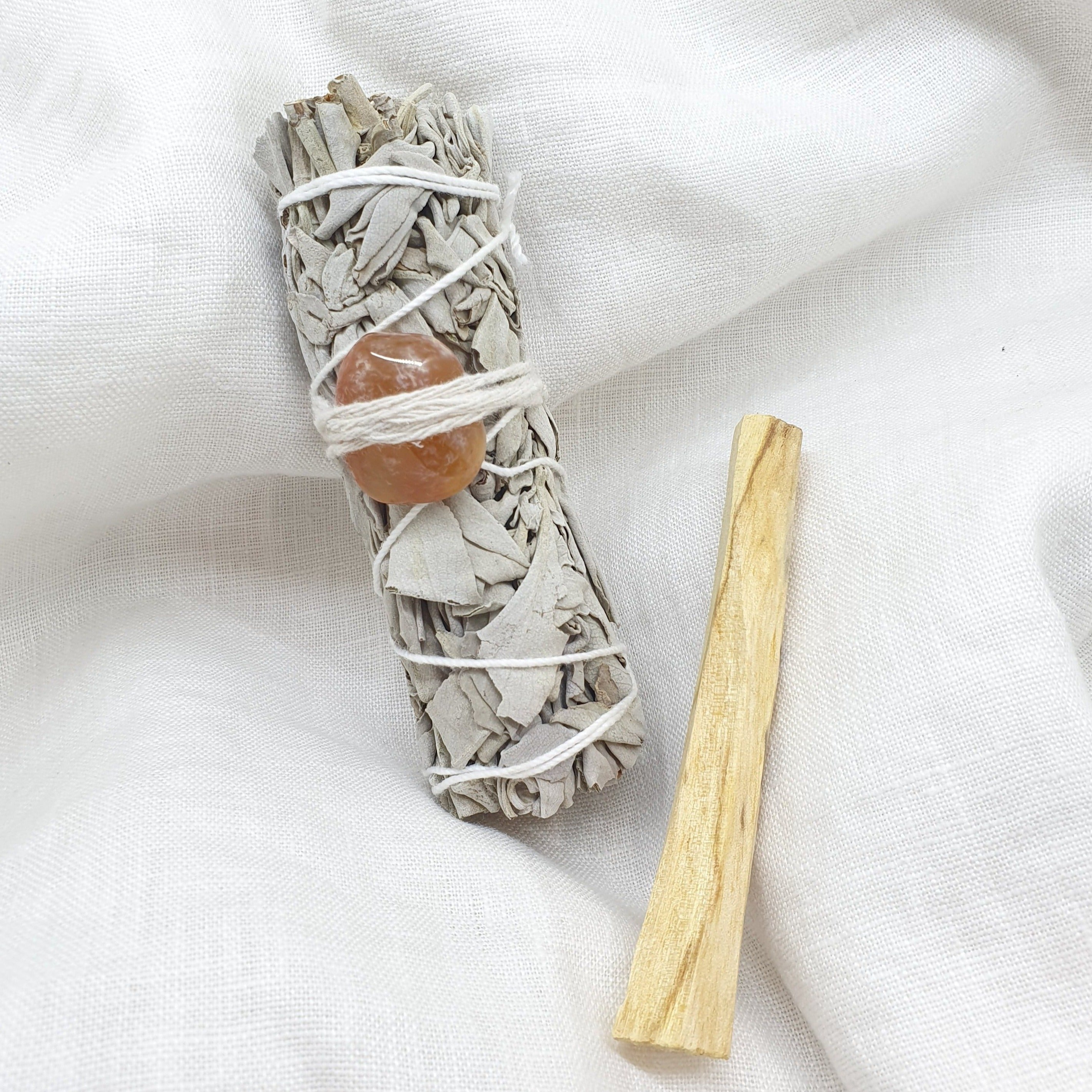 white sage with carnelian and palo santo smudge stick