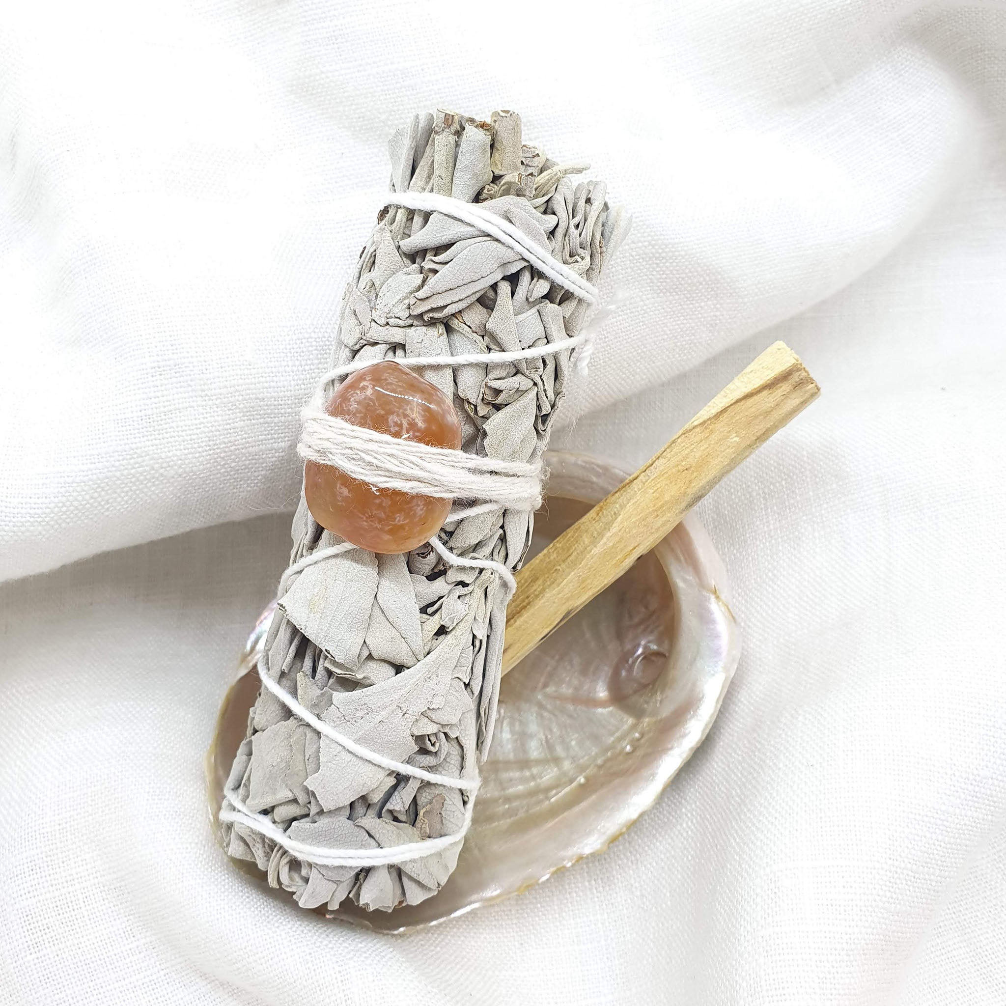 white sage smudge stick and palo santo