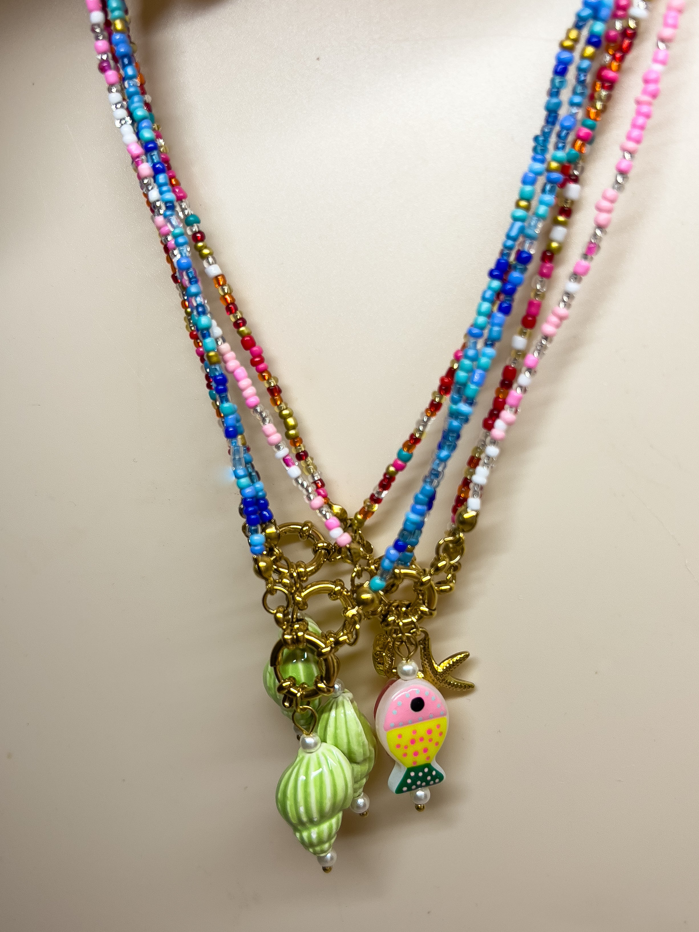 Beaded charm necklaces in multiple colours 