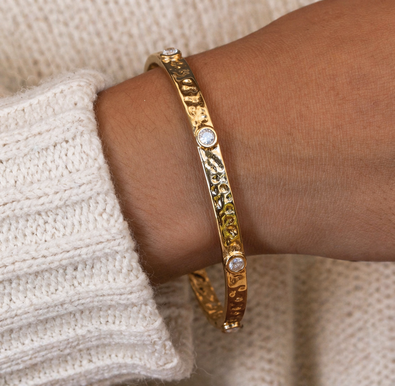 Gold Bangle on wrist 
