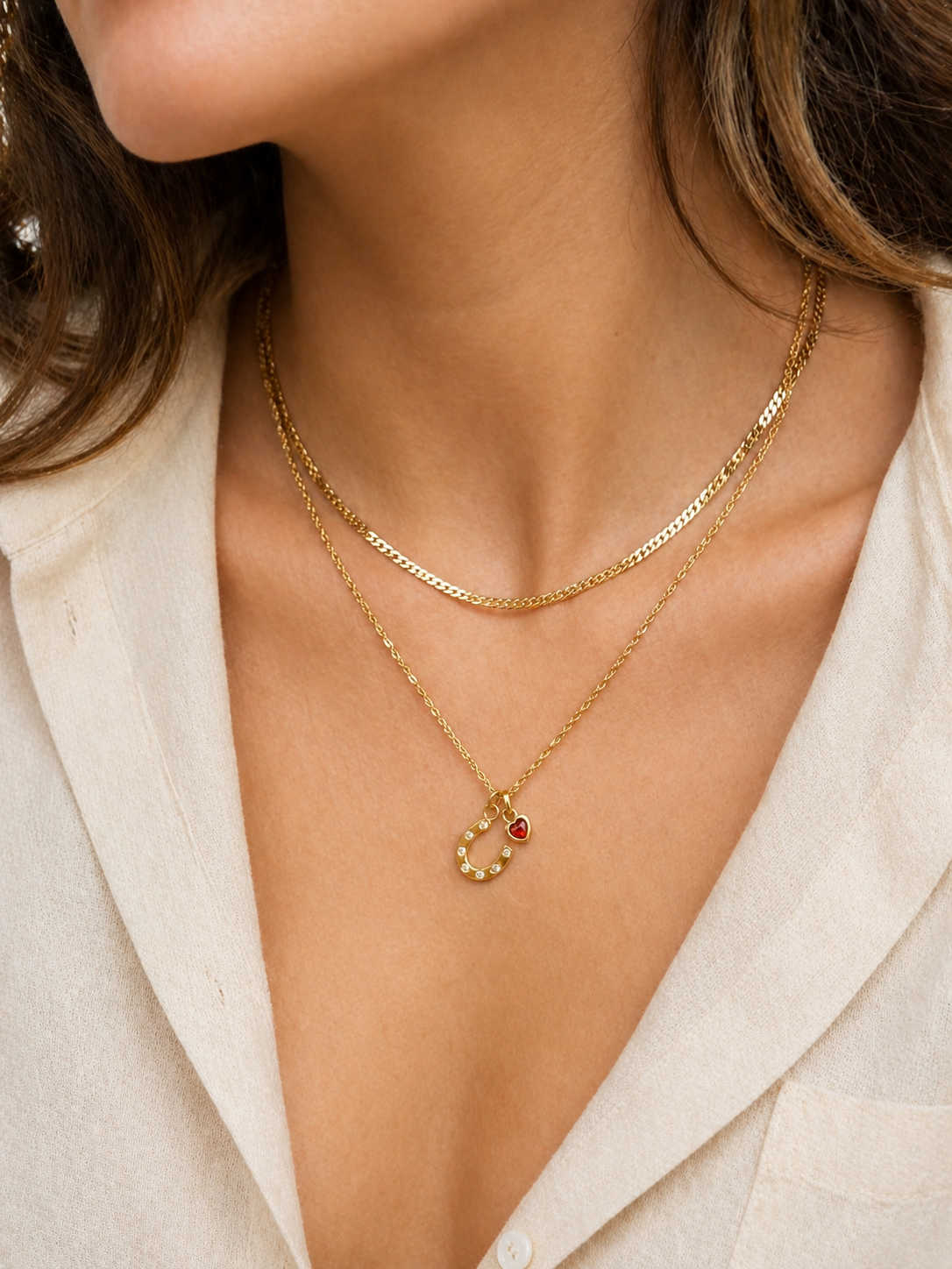 Model wearing lucky heart gold necklace and chain