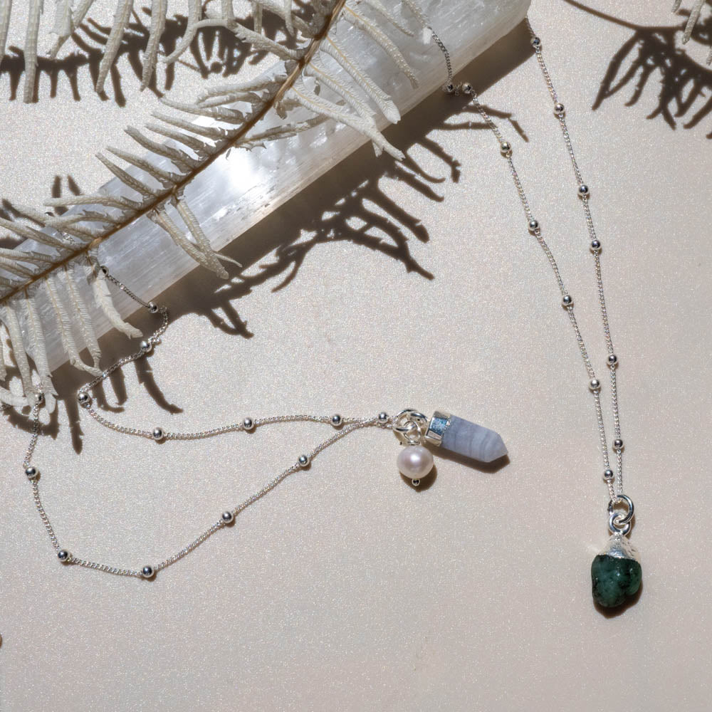blue lace necklace and emerald necklace