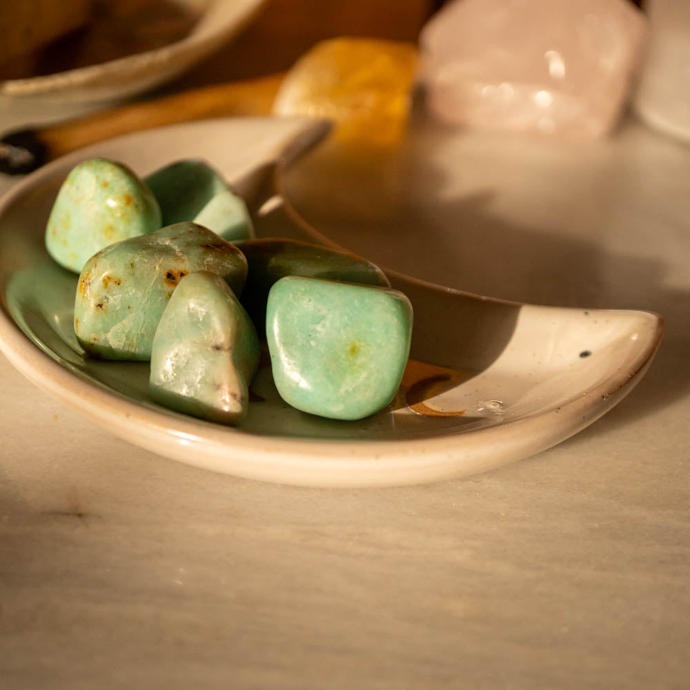 Chrysoprase stones in moon clay dish