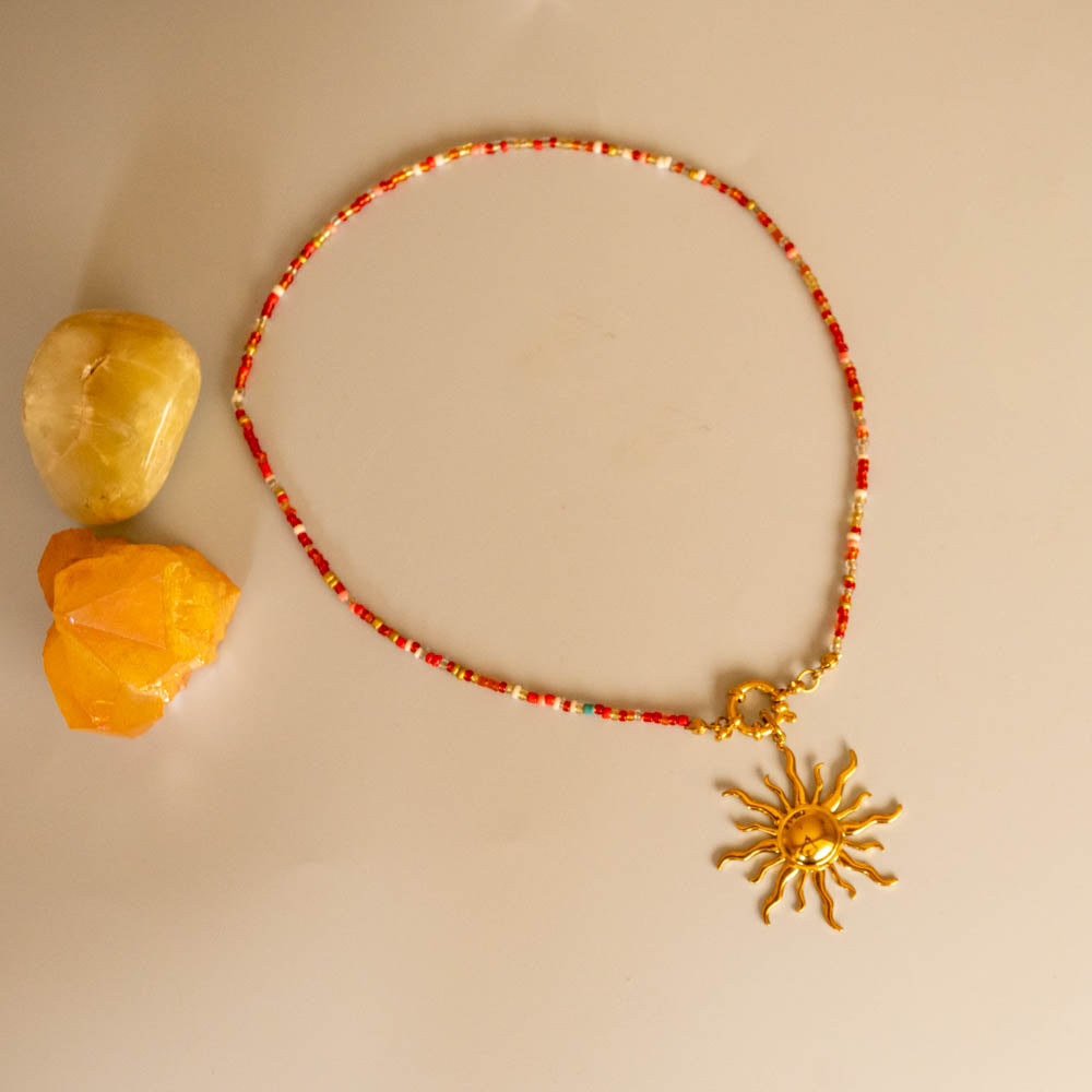 island sun charm red bead necklace 