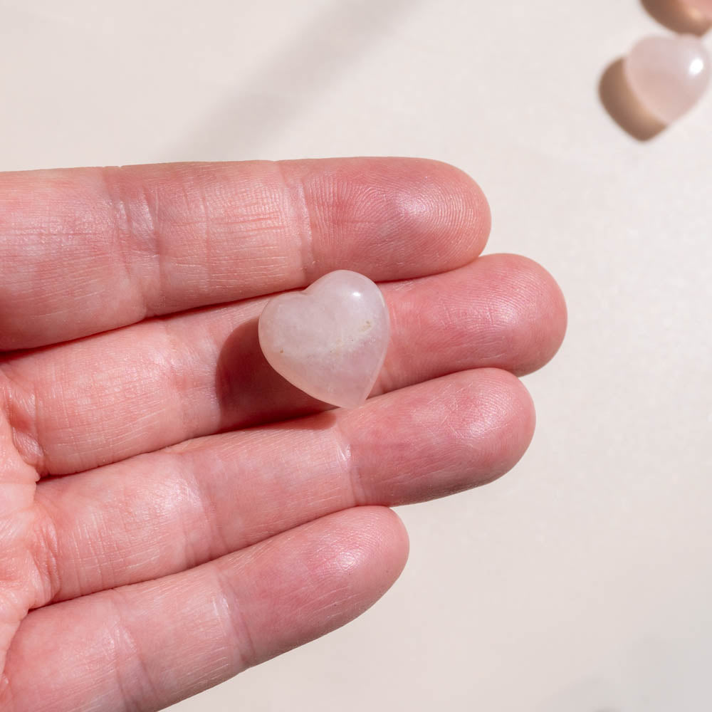 mini rose quartz heart in hand