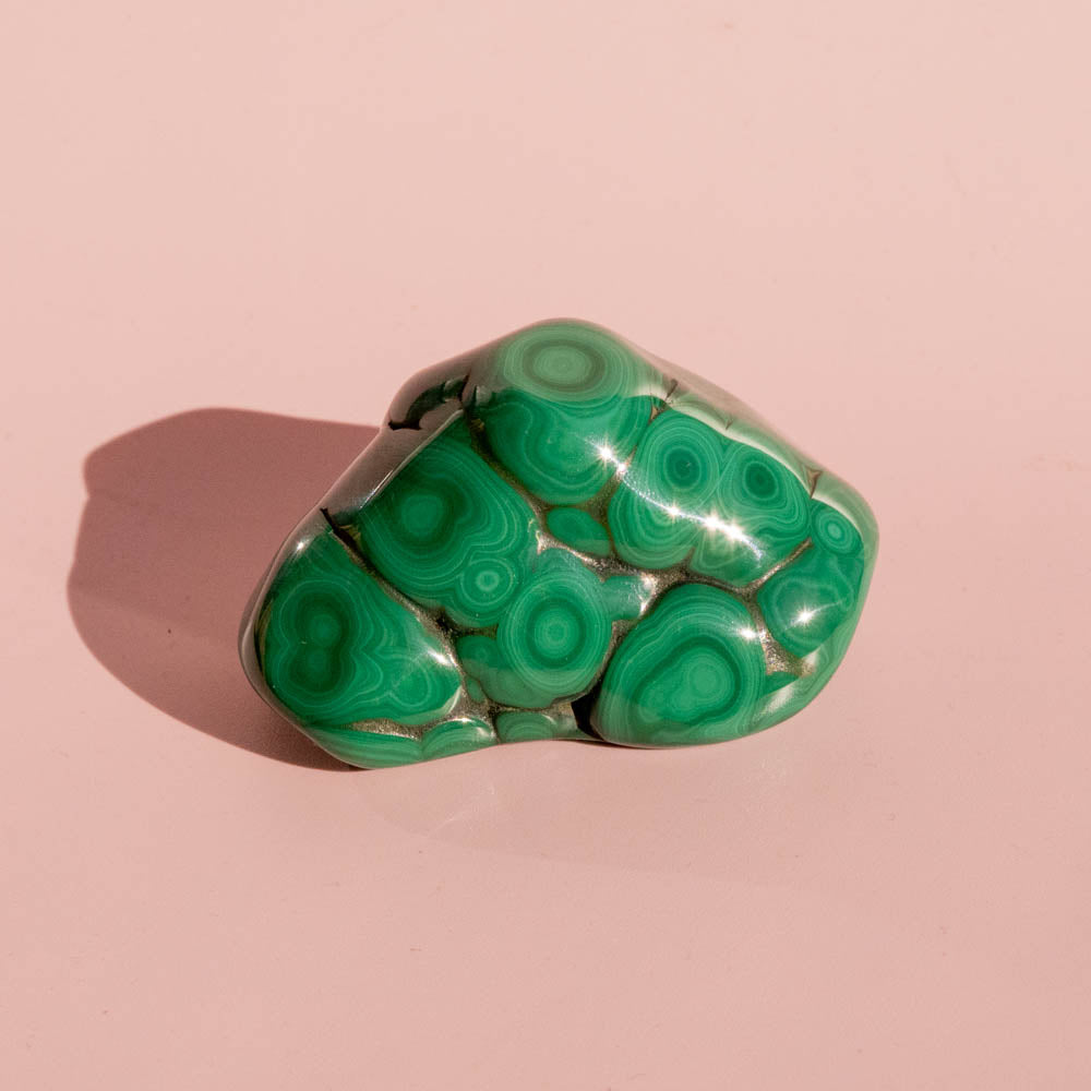 Green malachite on a pink background