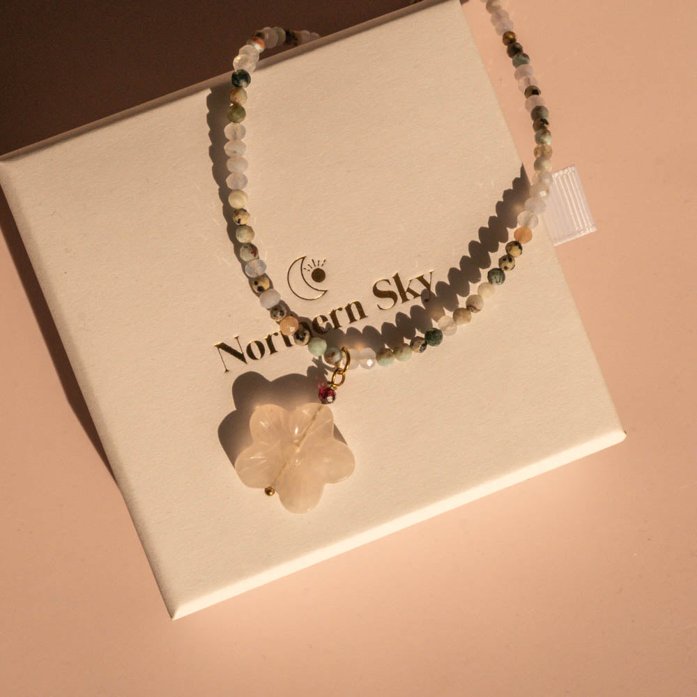 Ocean bloom necklace with flower pendant on branded Northern Sky box