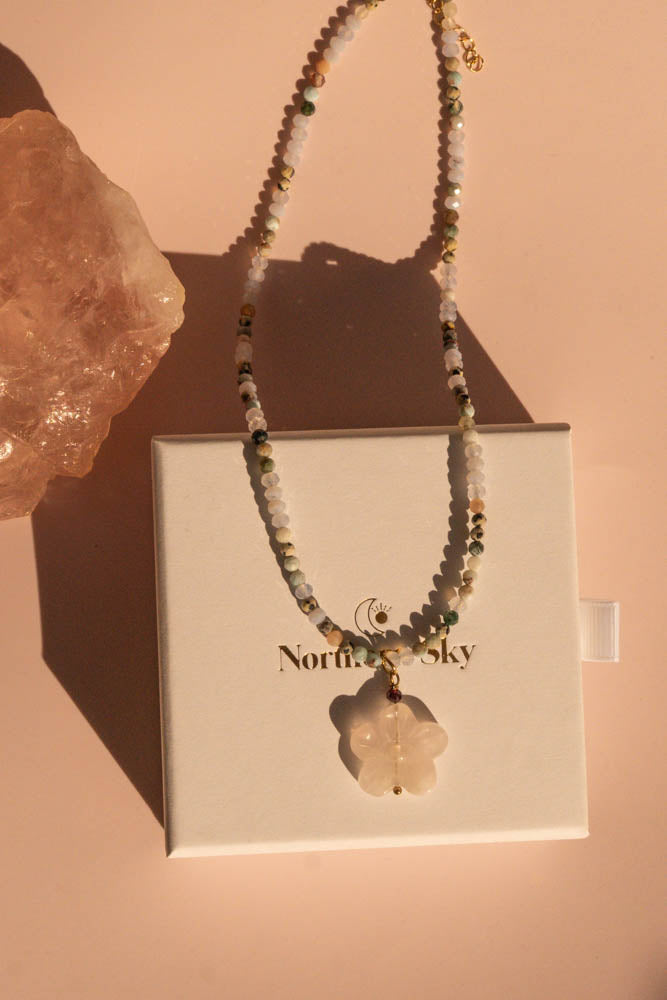 Ocean Bloom necklace with pendant on white branded gift box