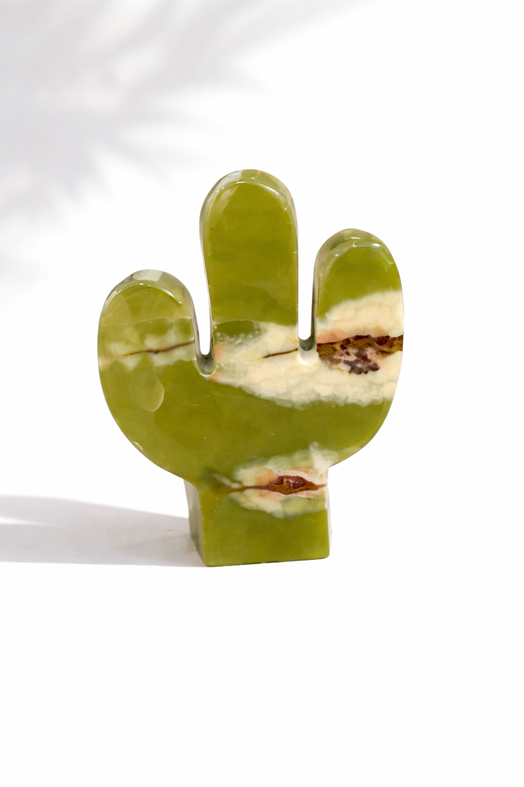 Green cactus-shaped onyx on a white background