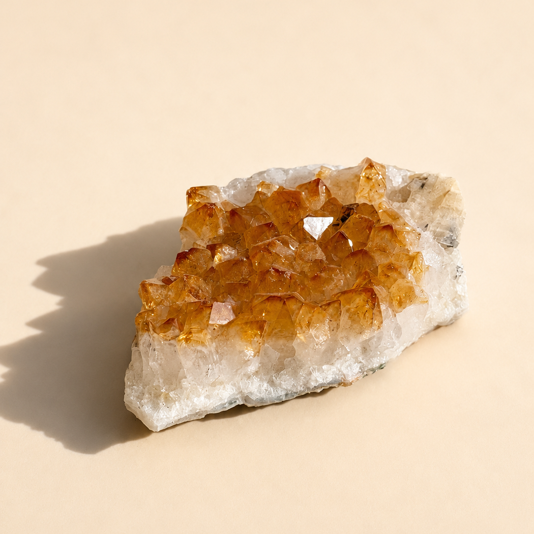 Citrine crystal on a beige background