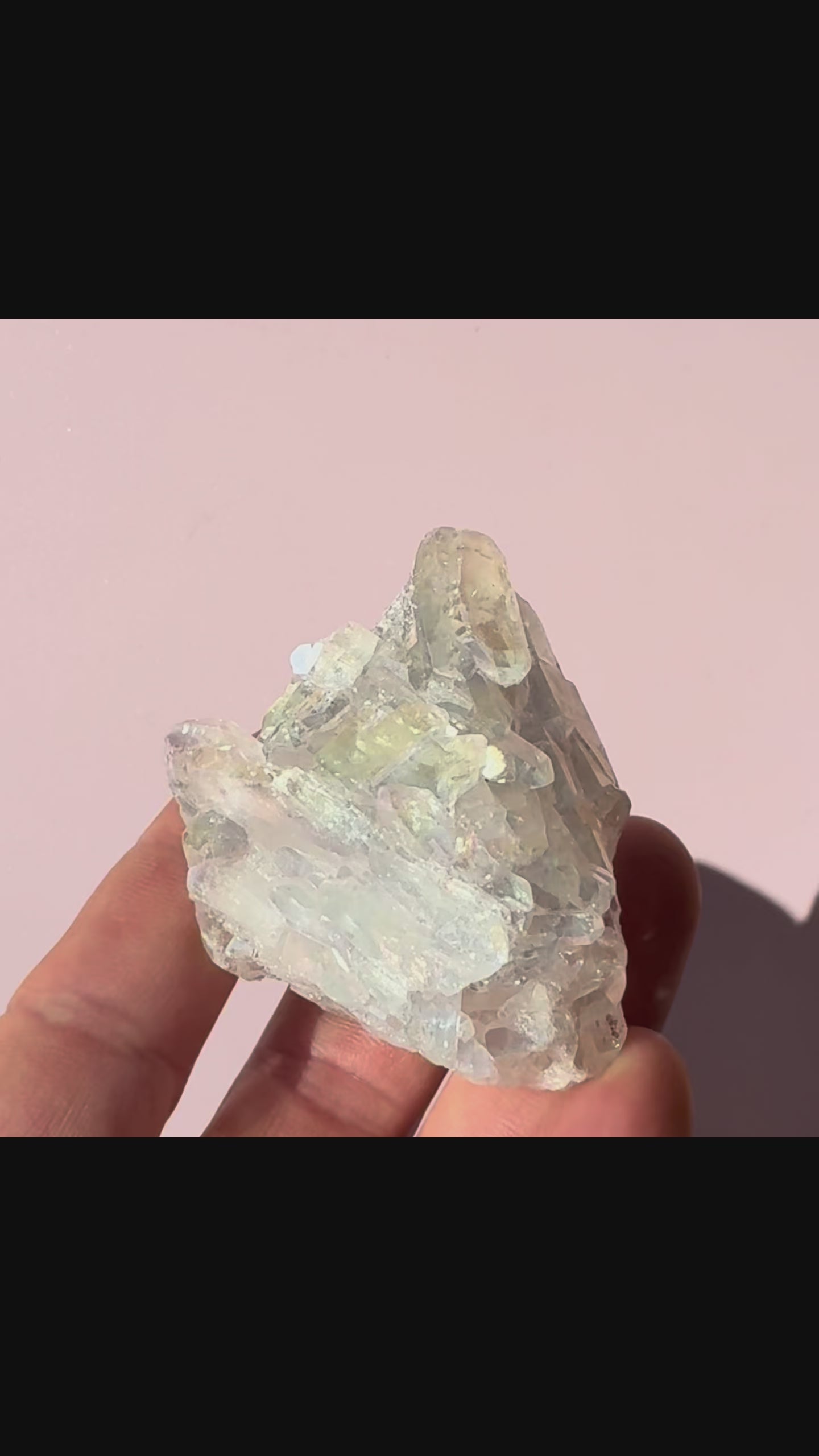 Angel Aura Quartz Cluster short video against pink background