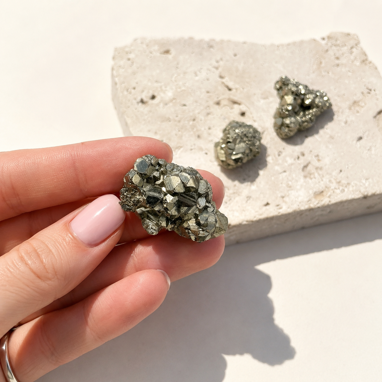 pyrite cluster in hand