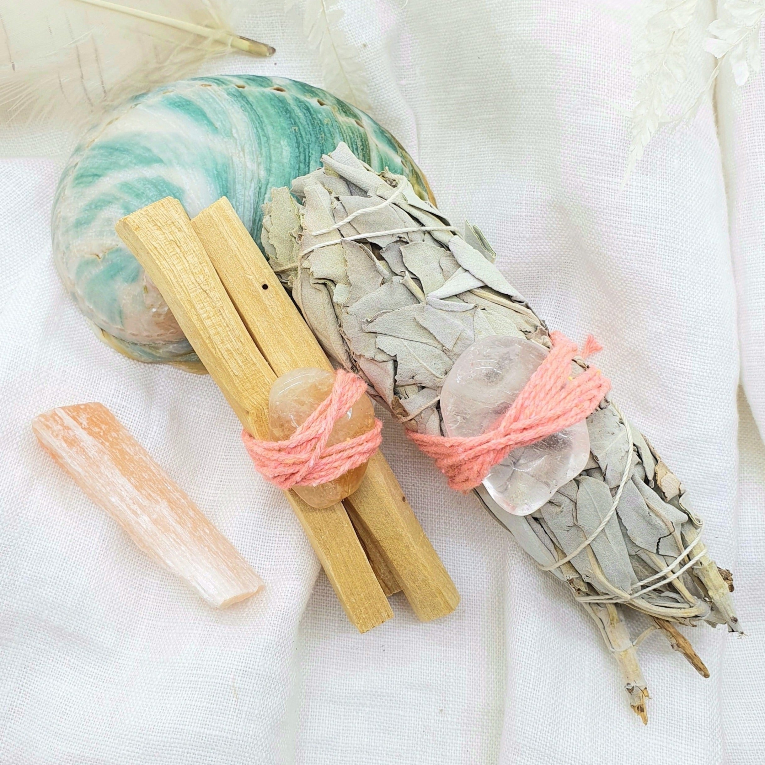 white sage and palo santo with crystals